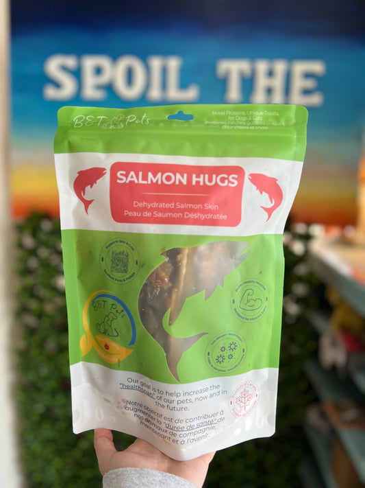 Green package of 'Salmon Hugs' with a blurred background