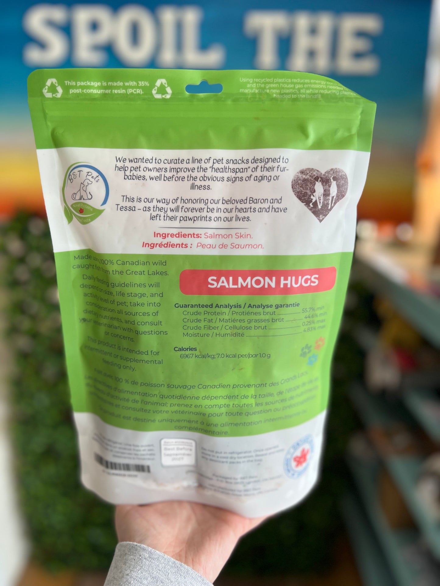 Package of Salmon Hugs pet snack with visible branding and text.