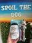 Dog fishing toy with packaging labeled 'Spoil the Dog' held by a hand against a blurred background.