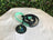 Dog leash set with 'Regal Canine' logo on a white surface with greenery in the background
