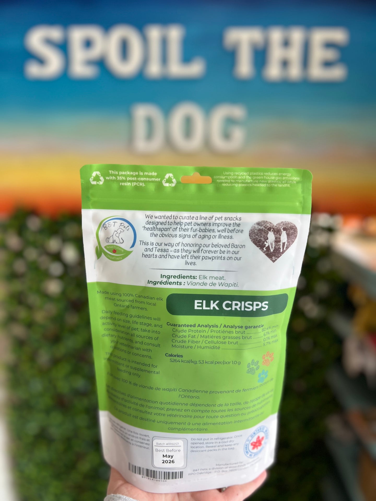 Package of 'Elk Crisps' for dogs with a blurred background and text.