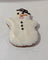snowman shaped dog cookie on white background