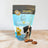 A package of Spoil the Dog bakery dog treats in Apple Coconut flavor, with a visual of a dog and the treats displayed in front.