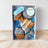 A packaged set of dog treats shaped like birthday cake and bones, decorated with yogurt and sprinkles, with a 'Happy BARKday' label.
