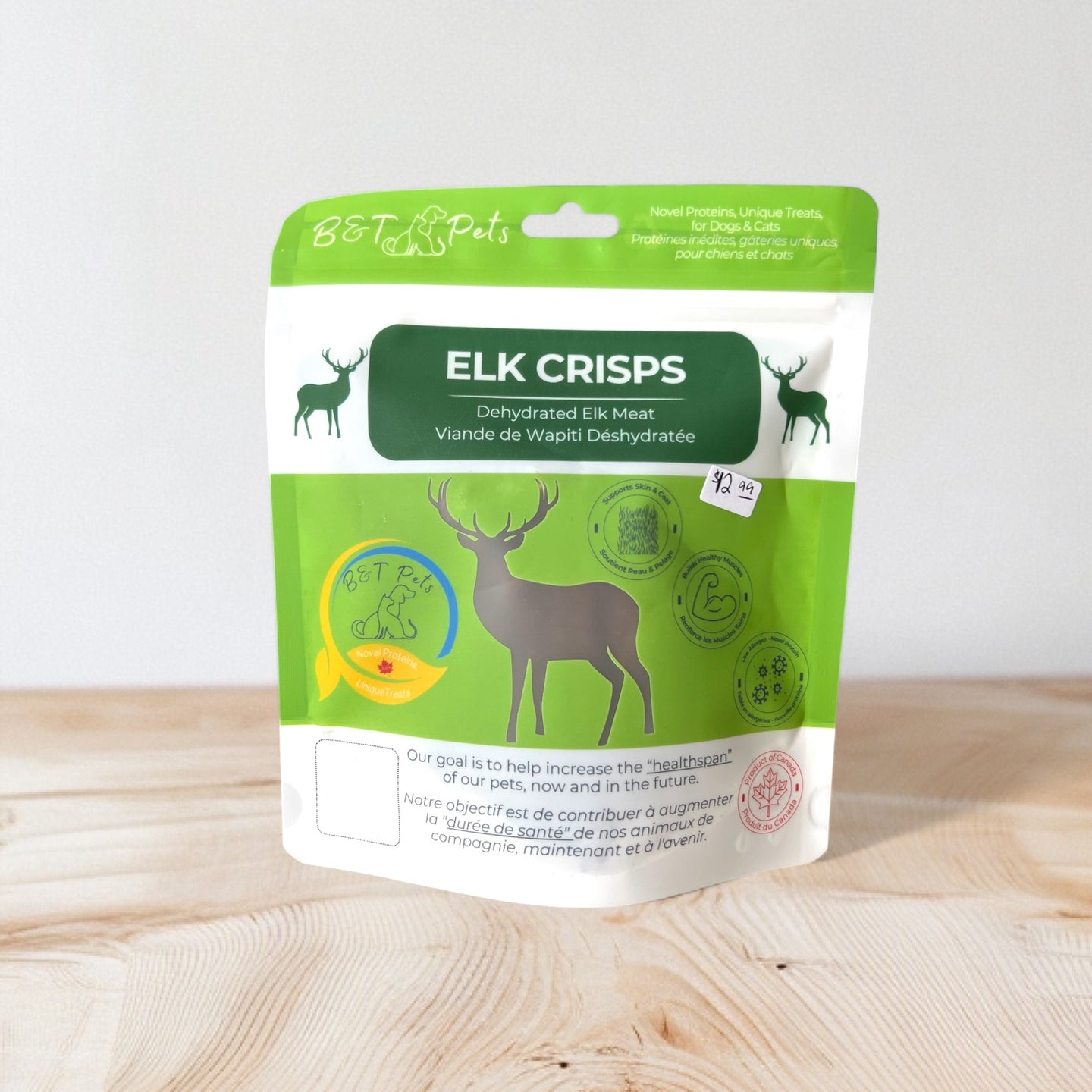 Package of Elk Crisps on a wooden surface with a white background