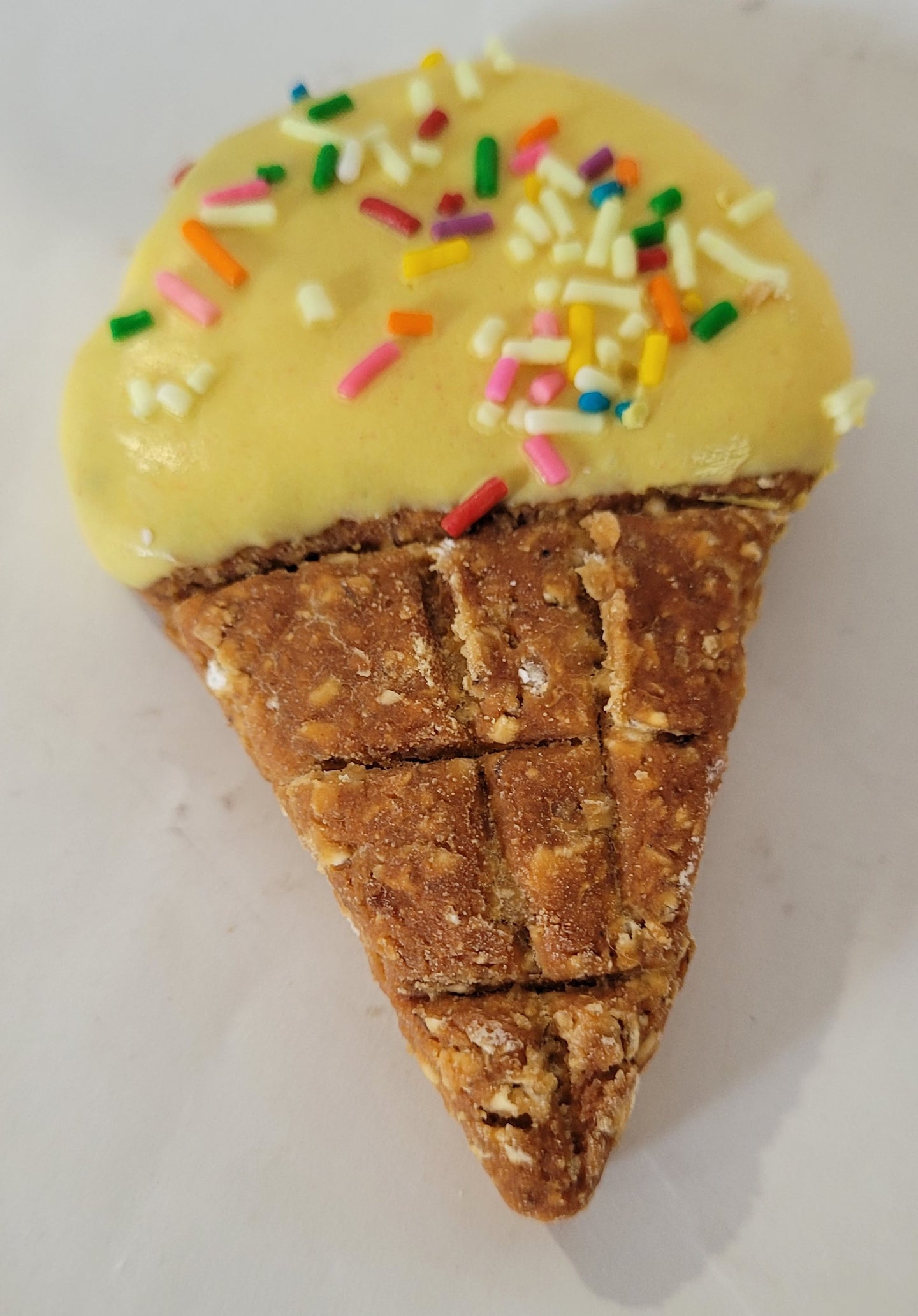 Yellow ice cream dog cookie.