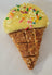 Yellow ice cream dog cookie.